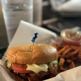 Crispy chicken sandwich cilantro jalapeño style with sweet potato fries