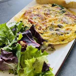 Frittata-Rustica Omelet with a side of salad.