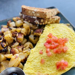 The Works (Omelet) with potatoes on the side.