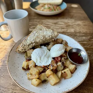 Parma hash- 2 eggs your style (poached here), Italian sausage, buttered multigrain toast, strawberry jam