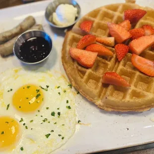 Trifecta breakfast with turkey sausage and sunny side up eggs. Special request; no powder sugar or butter on waffle.