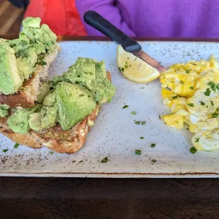 My friend&apos;s avocado toast (look at the amount of avocado!) with scrambled eggs.