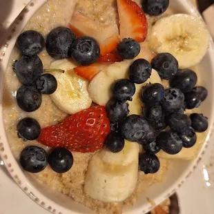 Kids oatmeal with brown sugar, blueberries, bananas, and strawberries