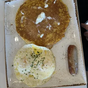 Pumpkin pancakes with egg and sausage
