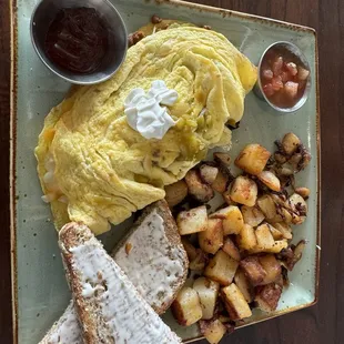 Chorizo green chile omelette con pico had some spice in there skillet potatoes and multi grain bread - $13