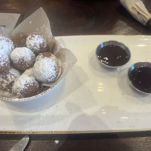 Cake donut holes! Chocolate and raspberry dipping sauce.