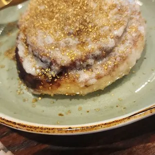 Stay Golden Cinnamon Roll -Sweet, warm, &amp; includes an unexpected crunch from the gold flakes.