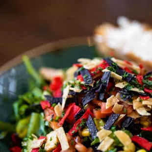 a plate of salad with bread