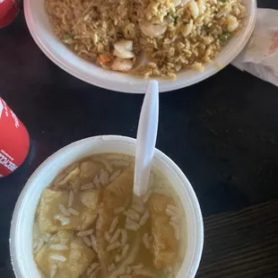 Sizzling rice soup and shrimp fried rice served on styrofoam