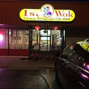 a car parked in front of a chinese restaurant