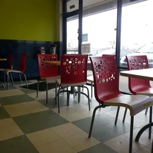 a view of a restaurant with tables and chairs