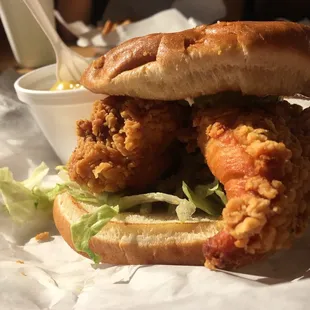 a fried chicken sandwich with lettuce
