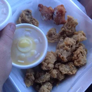 Chicken gizzard dinner with mash potato &amp; coleslaw sides.