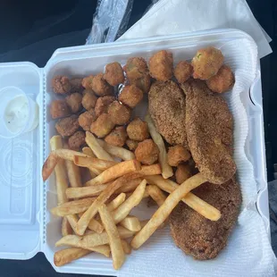 a tray of fried fish and french fries