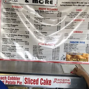 a woman ordering a slice of cake