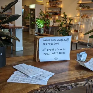 a wooden table with a sign on it