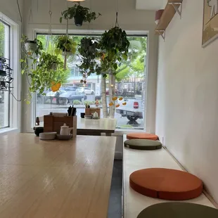 Inside decorated with plants, framed images and cushions from Snow Peak, a bougie outdoor store nearby.