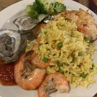 a plate of seafood and rice