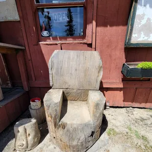 a chair made out of logs