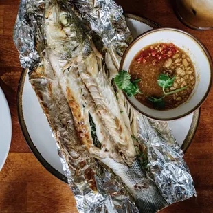 Grilled branzino with garlic peanut sauce