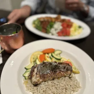 Front: Shrimp &amp; crab stuffed blackened flounder with a side of seasoned rice and sauté squash.  Back: shrimp Cobb salad.