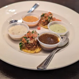 Soup sampler with oyster nachos. Soups include roasted jalapeno, clam chowder, crab bisque, and gumbo.