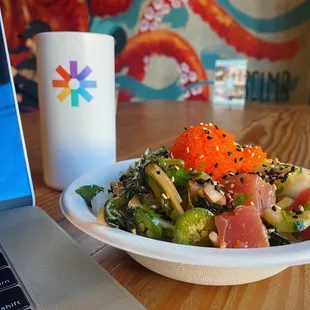 a bowl of food and a laptop