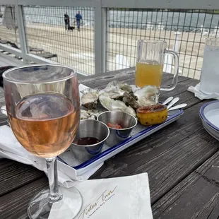 a plate of oysters and a glass of wine