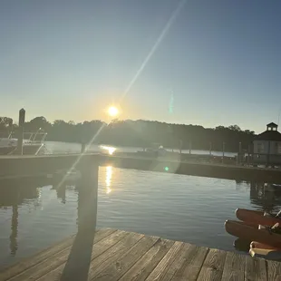 the sun setting over the water