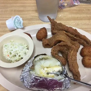 a plate of fried fish and coleslaw