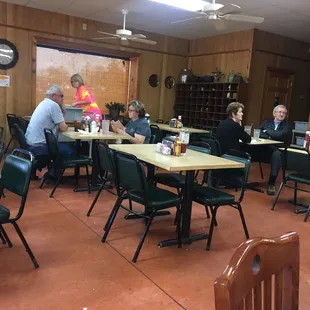 a group of people sitting at tables