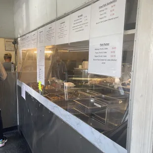 a woman standing in front of a counter