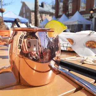 .Moscow mule strong vodka and lime and ginger drink served in shinyl stein.