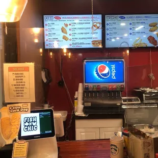 a restaurant counter and menus