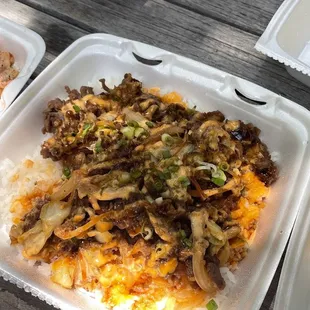 two take out containers of food