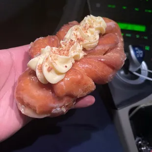 A grease twist donut with filling in sight