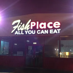 the front of the restaurant at night