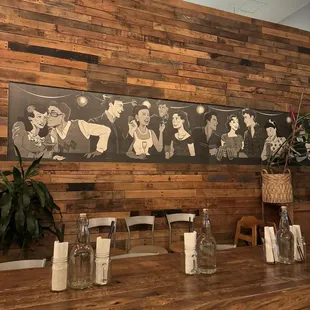 a restaurant with a wooden wall