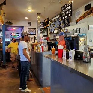 customers at the counter of the restaurant