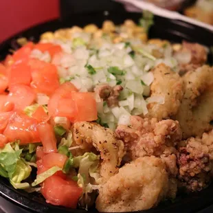 Salad bowl with calamari side of elote with spicy aioli sauce