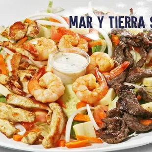 a plate of food with shrimp and vegetables