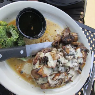 a plate of food with broccoli and sauce
