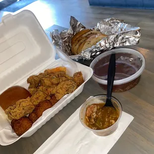 Shrimp and oyster combo, side hush pups, red beans and rice, garlic bread! BUSSIN