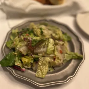 a salad on a plate on a table