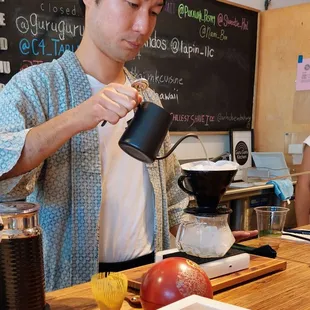 Barista Yuji prepares a Japanese style pour over at Fishcake.