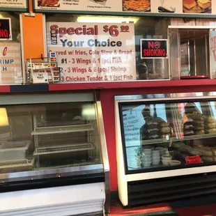a display case with a variety of food items