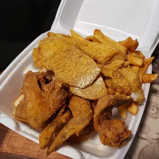 Fish and wings combo...come with Cole slaw,fries,and 2 slices of bread.