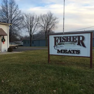 a sign in front of a building