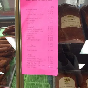 a list of meats in a display case