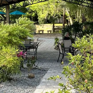 Outside dining, under the canopy near the canal.
